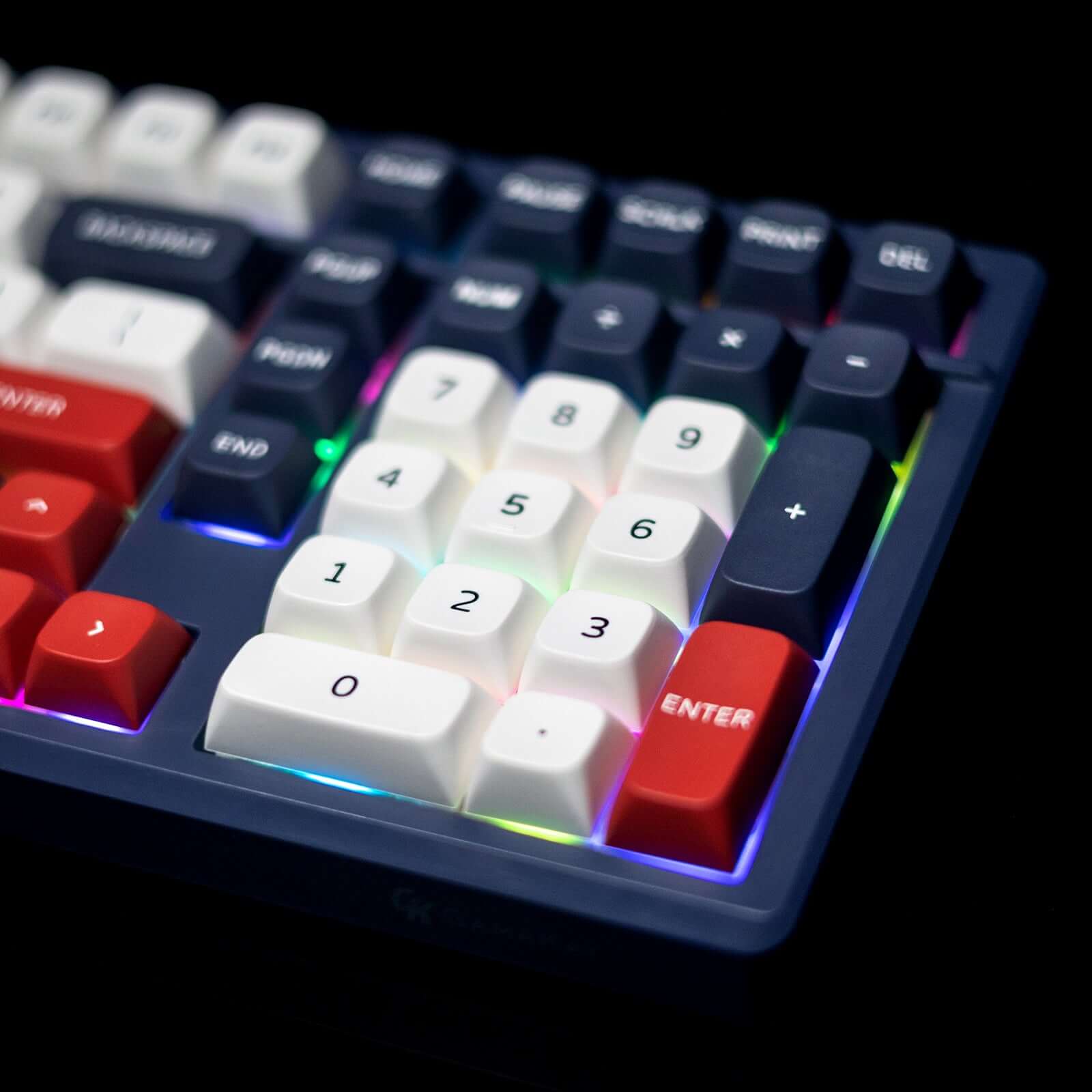 Close-up of Gamakay TK101 wireless mechanical keyboard highlighting brightly lit keys and numeric pad.